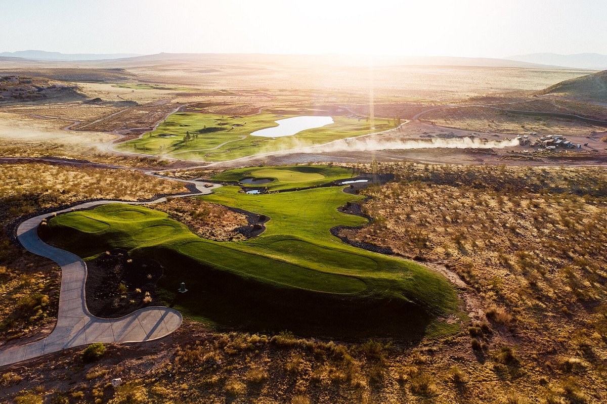 Aerial view of a desert golf hole near St. George at sunset